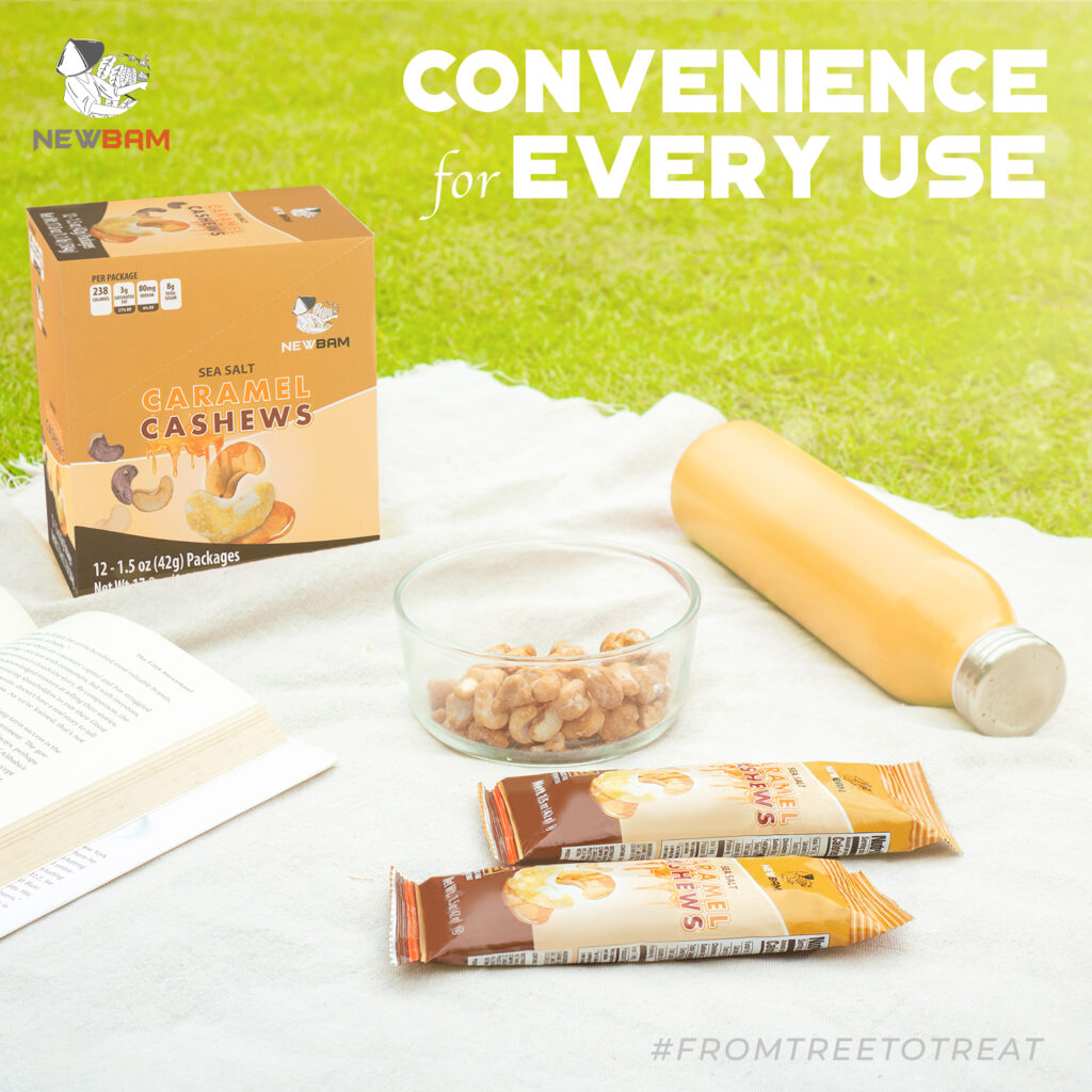 NEWBAM Sea Salt Caramel box, pouches and cashews on a picnic blanket.